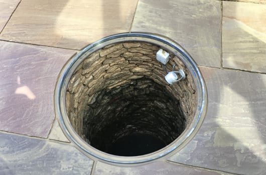 The old well, rebuilt and finished with honey paviors, lighting and glass dome