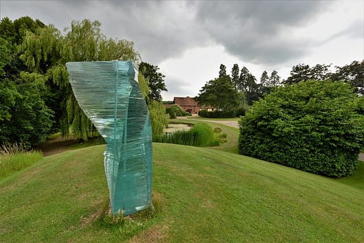 Grassy knoll topped with glass sculpture lawncare and extraordinary lawns