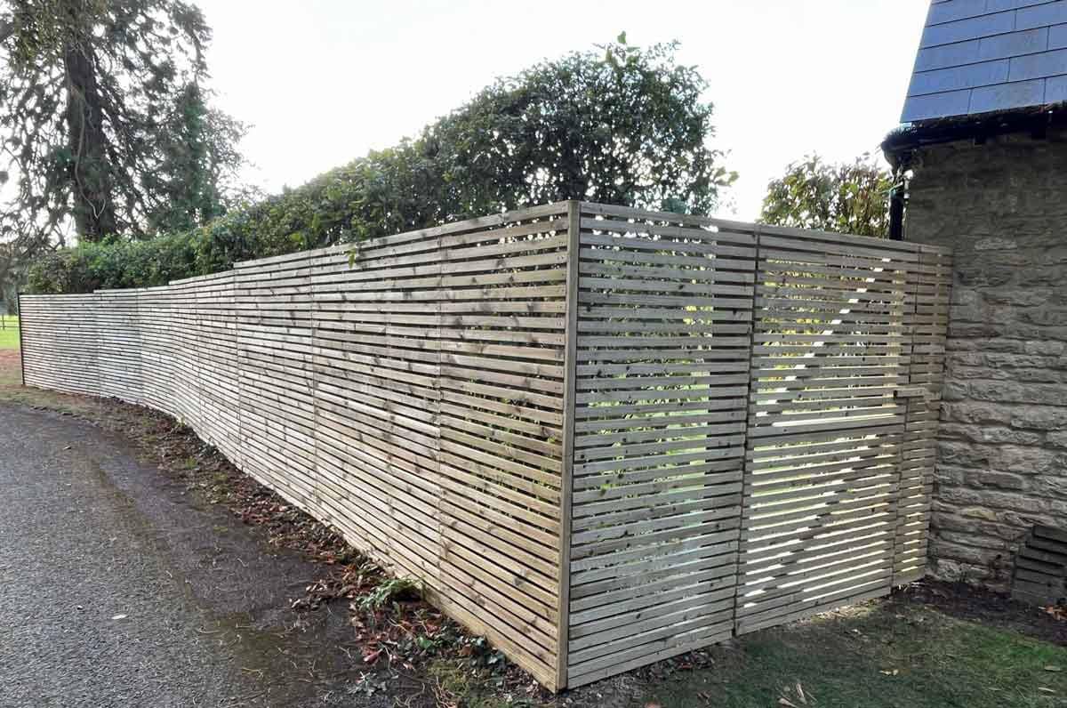 Contemporary bespoke fence crafted by The Oxfordshire Gardener for safety and sanctuary